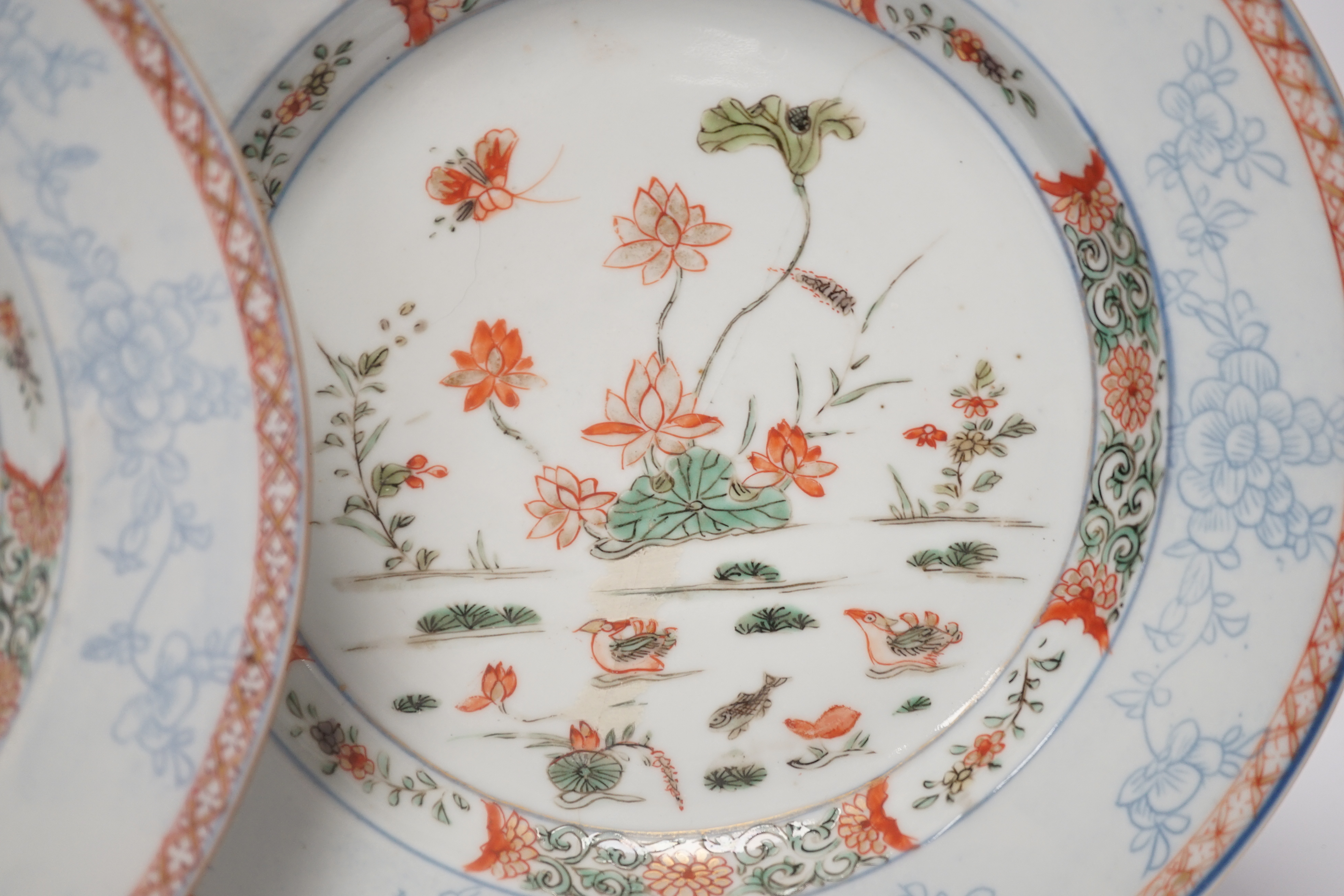 A pair of Chinese famille verte ‘lotus pond’ plates, Kangxi-Yongzheng period, 22.5cm